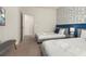 Cozy bedroom with two twin beds, TV and access to hallway at 8968 Silver Pl, Kissimmee, FL 34747