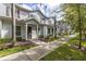 Exterior view of townhouses with landscaping and walkway at 8968 Silver Pl, Kissimmee, FL 34747