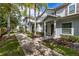 Townhouse exterior with walkway and landscaping at 8968 Silver Pl, Kissimmee, FL 34747