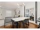 Modern dining area with marble table and chairs, near living room and kitchen at 8968 Silver Pl, Kissimmee, FL 34747