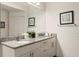 Elegant bathroom with granite countertops, double sinks, and ample storage at 8968 Silver Pl, Kissimmee, FL 34747