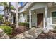 Inviting exterior of light-blue townhouse with landscaping at 8968 Silver Pl, Kissimmee, FL 34747