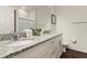 Elegant bathroom with granite countertops and double sinks at 8968 Silver Pl, Kissimmee, FL 34747