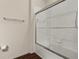 Clean bathroom with a tub and shower, and glass sliding doors at 8968 Silver Pl, Kissimmee, FL 34747