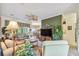 Open concept living room with a view into the dining area at 227 Verona Dr, Poinciana, FL 34759