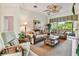 Spacious living room with comfortable seating and a view to the backyard at 227 Verona Dr, Poinciana, FL 34759