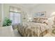 Bedroom with a queen-size bed, nightstands, and window coverings at 227 Verona Dr, Poinciana, FL 34759