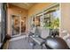 Relaxing screened porch with seating and grill at 227 Verona Dr, Poinciana, FL 34759