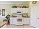 Bright kitchen with white cabinets and modern appliances at 227 Verona Dr, Poinciana, FL 34759