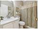 Small bathroom with shower, toilet and vanity at 227 Verona Dr, Poinciana, FL 34759
