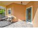 Quaint front porch with seating area, inviting entryway at 227 Verona Dr, Poinciana, FL 34759