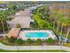 Community pool with surrounding patio furniture and landscaping at 227 Verona Dr, Poinciana, FL 34759