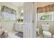 Main bathroom features a toilet, vanity, and a shower/tub combo at 227 Verona Dr, Poinciana, FL 34759