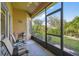Enjoy the view from this screened porch with outdoor seating at 227 Verona Dr, Poinciana, FL 34759