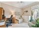 Bright home office with built-in desk and seating area at 227 Verona Dr, Poinciana, FL 34759