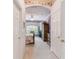 Hallway leading to the Primary bedroom with neutral colors and carpet flooring at 227 Verona Dr, Poinciana, FL 34759
