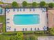 Overhead view of a rectangular community pool with surrounding lounge chairs at 227 Verona Dr, Poinciana, FL 34759