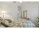 Bedroom with a queen bed, dresser, and ceiling fan at 227 Verona Dr, Poinciana, FL 34759