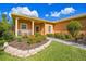 Well-maintained landscaping, inviting walkway to a charming house at 227 Verona Dr, Poinciana, FL 34759