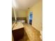 Bathroom with corner bathtub, granite vanity and toilet at 1980 Poblado Ct, Kissimmee, FL 34744