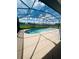 Relaxing kidney-shaped pool with screened enclosure at 1980 Poblado Ct, Kissimmee, FL 34744