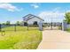 Two-story home with gated entrance and landscaping at 1980 Poblado Ct, Kissimmee, FL 34744