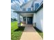Two-story house with a modern facade, stone accents, and a covered porch at 1980 Poblado Ct, Kissimmee, FL 34744