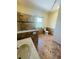 Large bathroom with walk-in shower, toilet and tiled floor at 1980 Poblado Ct, Kissimmee, FL 34744