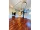 Bedroom with hardwood floors, a ceiling lift, and walk-in closet at 1980 Poblado Ct, Kissimmee, FL 34744
