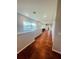 Long hallway with hardwood floors and high ceilings at 1980 Poblado Ct, Kissimmee, FL 34744