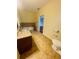 Bathroom with corner bathtub, granite vanity and toilet at 1980 Poblado Ct, Kissimmee, FL 34744