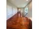 Hardwood floor hallway with multiple doors and windows at 1980 Poblado Ct, Kissimmee, FL 34744