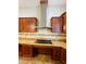 Modern kitchen with granite countertops and stainless steel appliances at 1980 Poblado Ct, Kissimmee, FL 34744