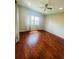 Bright bedroom with hardwood floors and window at 1980 Poblado Ct, Kissimmee, FL 34744