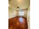 Spacious bedroom with hardwood floors and ceiling fan at 1980 Poblado Ct, Kissimmee, FL 34744