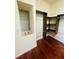 Spacious walk-in closet with custom built-ins and hardwood floors at 1980 Poblado Ct, Kissimmee, FL 34744