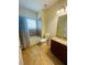 Clean bathroom, bathtub, toilet and granite countertop at 1980 Poblado Ct, Kissimmee, FL 34744