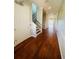 Bright and airy entryway with hardwood floors and staircase at 1980 Poblado Ct, Kissimmee, FL 34744