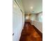 Bright hallway with hardwood floors and white doors at 1980 Poblado Ct, Kissimmee, FL 34744