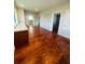 Spacious bedroom with hardwood floors and ensuite bath at 1980 Poblado Ct, Kissimmee, FL 34744