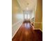 Elegant entryway showcasing hardwood floors and a grand staircase at 1980 Poblado Ct, Kissimmee, FL 34744