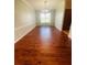 Formal dining room featuring hardwood floors and a large window at 1980 Poblado Ct, Kissimmee, FL 34744