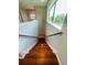 Elegant hardwood staircase leading to upper level at 1980 Poblado Ct, Kissimmee, FL 34744