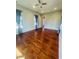 Spacious bedroom with hardwood floors and access to a bathroom at 1980 Poblado Ct, Kissimmee, FL 34744