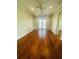 Spacious Gathering room with hardwood floors and access to the pool at 1980 Poblado Ct, Kissimmee, FL 34744