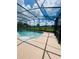 Relaxing screened pool with backyard view at 1980 Poblado Ct, Kissimmee, FL 34744