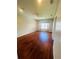 Well-lit bedroom with hardwood floors and a window at 1980 Poblado Ct, Kissimmee, FL 34744