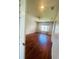 Bright bedroom with hardwood floors and window at 1980 Poblado Ct, Kissimmee, FL 34744