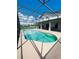 Inviting screened pool with a spacious patio area at 1980 Poblado Ct, Kissimmee, FL 34744