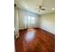 Spacious bedroom with hardwood floors and window at 1980 Poblado Ct, Kissimmee, FL 34744